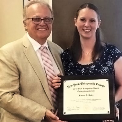 Katrina Andre receiving an award